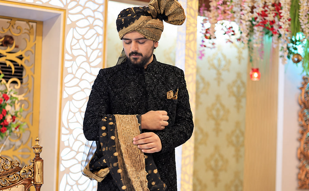 1.	Pearl white groom’s sherwani with complete hand work across the body, worn closed to the knee for an ivory barat look